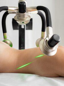 Faceless naked woman getting weight loss procedure